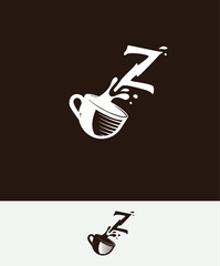a cup of coffee with the letter Z spilled