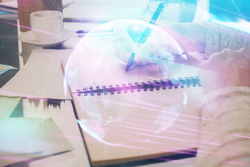 Technology theme hologram over woman's hands taking notes background. Concept of Tech. Double exposure