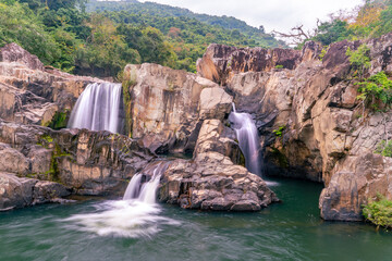 The amazing view of stream of water of waterfall in Yanoda Rain Forest national park on Hainan in...