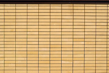 Modern abstract yellow brick wall background.
