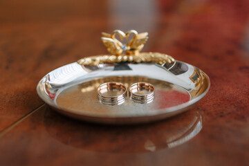 Gold wedding rings lying in a special stand