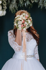 beautiful wedding bouquet in the hands of the bride. The bride holds a bouquet