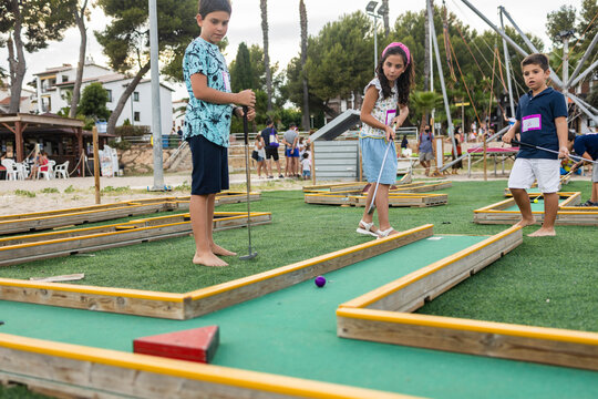 Children Playing Mini Golf