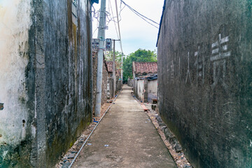 The rural street view of old traditional fisherman village on Hainan in China