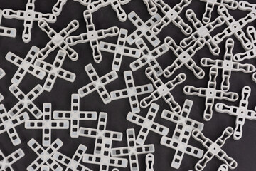 Close up of cross spacers for laying tiles