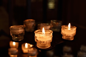Burning candles in church.
