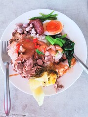 Pork leg rice and vagetable on plate