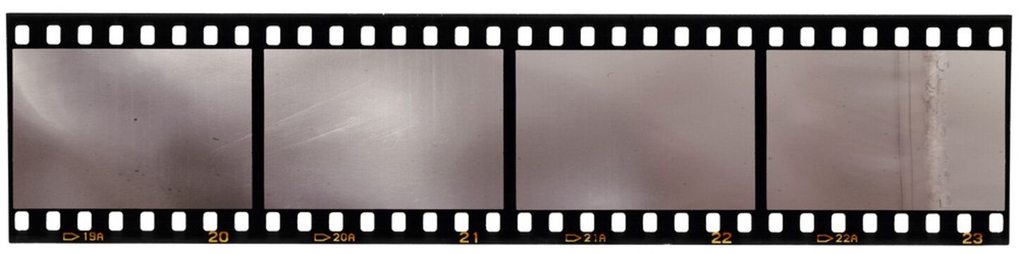 real scan of 35mm film strip or film material isolated on white background, just blend in your own content to make it look old and vintage
