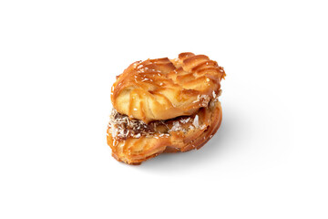 Profiteroles with condensed milk isolated on white background.