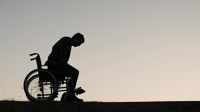 Man standing up from the wheelchair