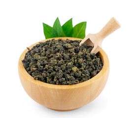Dry green oolong tea in wooden bowl an isolated on white background