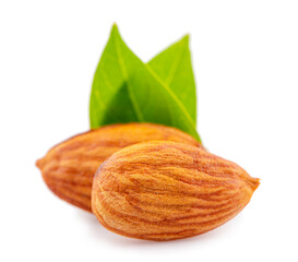 Close-up of almonds with leaves, isolated on white background