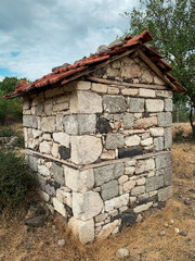 Small old stone building in the isolated mountain village of Lisitsite, Bulgaria