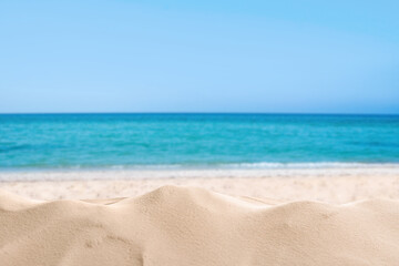 Fototapeta na wymiar Beautiful sandy beach near sea under blue sky