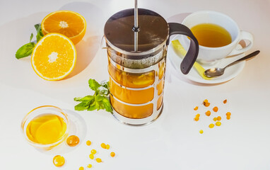 Hot citrus tea with lemon, fresh mint and fruit. Tea party with fruit in the restaurant