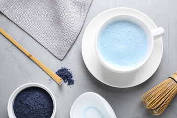 Fototapeta na wymiar Flat lay composition with blue matcha latte on grey table