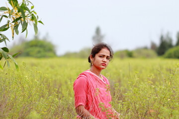 Indian woman posing in th field