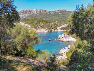 Fototapeta premium Beautiful beach bay shore with boats, Liapades Greece