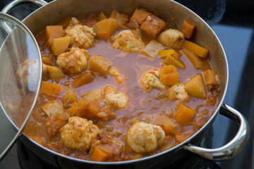 Traditional pumpkin Kubbe soup, a famous middle eastern dumplings soup dish, boiled in a pot