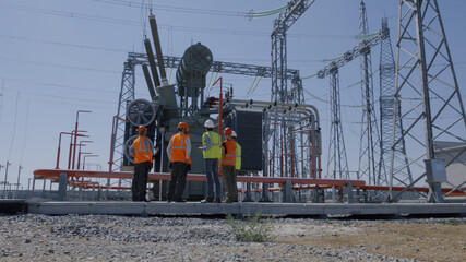 Engineers inspecting modern power plant