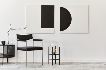 Interior design of modern living room with black stylish commode, chair, mock up art paintings,...