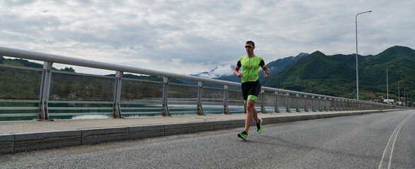 triathlon athlete running on street