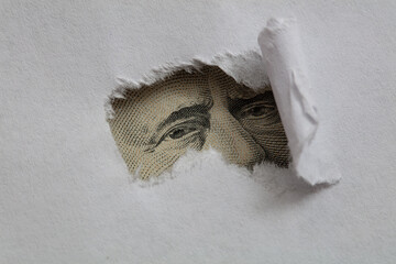  Ulysses S. Grant macro peeking through torn white paper