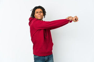 Young african american rasta man stretching arms, relaxed position.