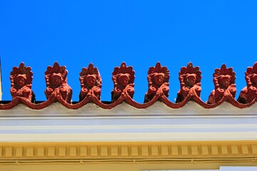 Decorative elements on the rooftop of a neoclassical house, in the traditional neighborhood of Plaka in Athens, Greece.