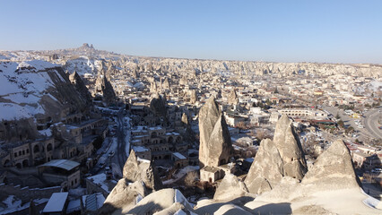Snowy Cappadocia fairy chimneys rock formations during winter near G&ouml;reme, Turkey.