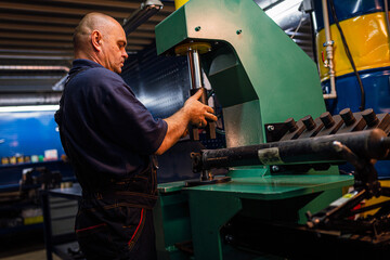 Male engineer metalworker industrial experienced operator technician worker working on machine with metal, professional man in industry technology manufacturing factory workshop, artistic noise