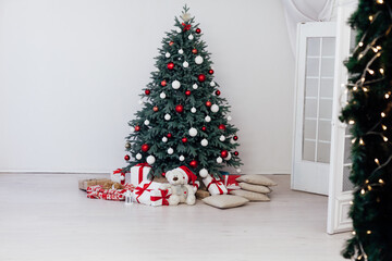 Christmas tree blue pine with gifts interior decor white room new year winter holiday