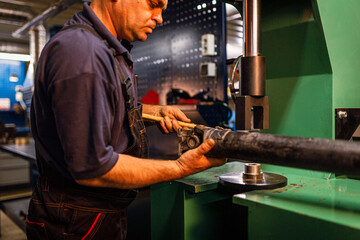 Male engineer metalworker industrial experienced operator technician worker working on machine with metal, professional man in industry technology manufacturing factory workshop, artistic noise