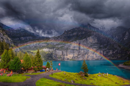 lake, mountains, and a double rainbow - How lucky can one get to see a double rainbow over Oschinen lake. The photo was captured after a day hike from the mountains.