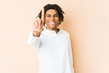 Young african american rasta man showing number one with finger.