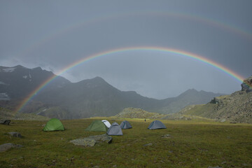 rainbow during the storm in the mountains