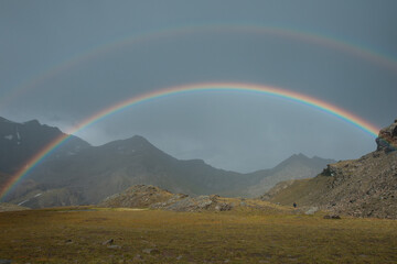 rainbow during the storm in the mountains