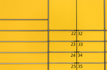 Post office box. Yellow post box for rentals.