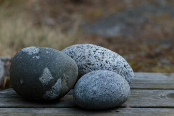 Group of stones on wooden decking