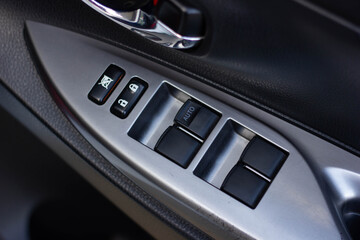 Plakat Car arm rest with Control Panel. Door Lock & Mirror Control. window adjustment buttons, door lock. Photography of a modern car.