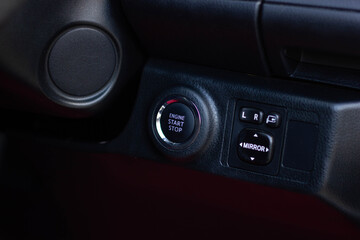 Fototapeta premium Close up engine car start button. Start stop engine modern new car button,Makes it easy to turn your auto mobile on and off. a key fob unique ,selective focus