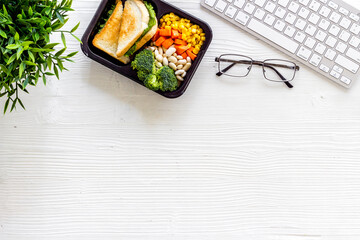 Lunch at workplace. Delivery boxes with meal, top view