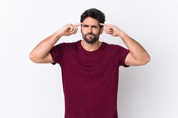 Young handsome man with beard over isolated white background having doubts and thinking
