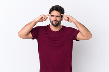 Fototapeta premium Young handsome man with beard over isolated white background having doubts and thinking