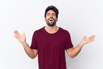 Young handsome man with beard over isolated white background smiling a lot