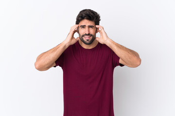 Young handsome man with beard over isolated white background frustrated and covering ears