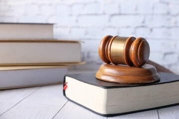 Close up of gavel and books on table 