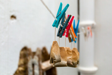 Drying clips laundry hanger with used tea sachets bags