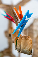 Drying clips laundry hanger with used tea sachets bags