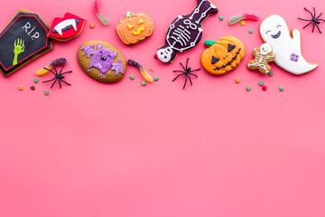 Set of Halloween cookies with candies flat lay, overhead view